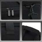 Black rectangular camera carrying bag with two top handles, a front zip pocket and a shoulder strap