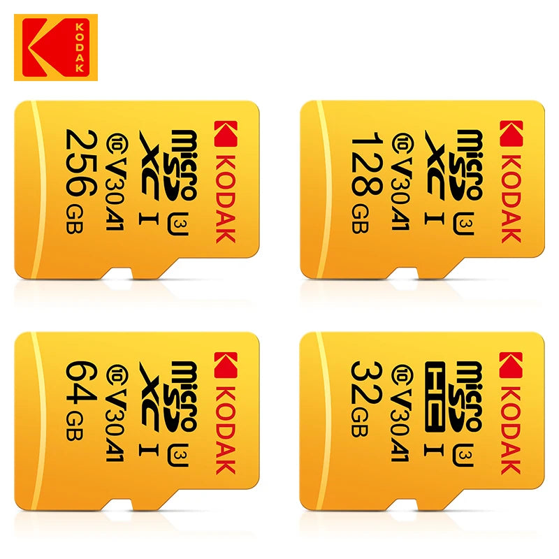 Yellow Kodak-branded microSDXC card in retail packaging with an SD adapter, beside 256GB, 128GB, 64GB and 32GB cards