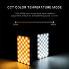 White pocket LED light with a small color screen, shown glowing in rainbow colors, with a diffuser cap, mount and cable