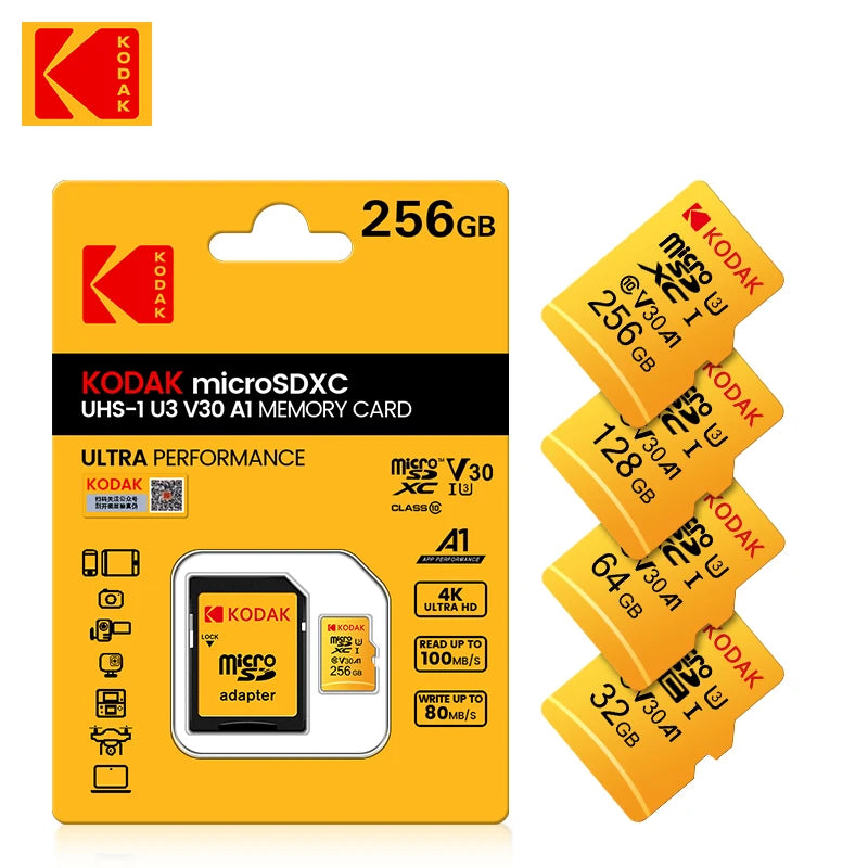 Yellow Kodak-branded microSDXC card in retail packaging with an SD adapter, beside 256GB, 128GB, 64GB and 32GB cards