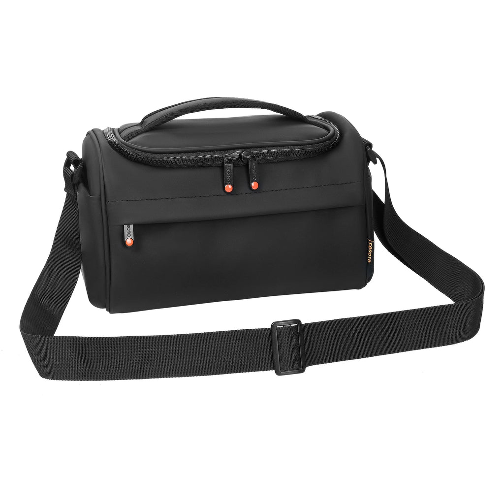 Black camera shoulder bag open to an orange padded interior, a small lens inside and a hand lowering a zoom lens in