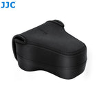 Contoured black soft camera pouch with a zip around the body and two small loops, shown closed on a white background