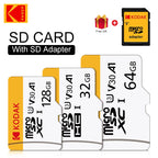 White and yellow Kodak-branded microSD cards in 128GB, 32GB and 64GB, beside a yellow microSD to SD adapter