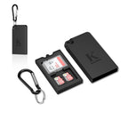 Black Kiorafoto pop-up card case open with an SD card and two microSD cards in its slots, shown with a carabiner