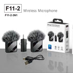 Two black clip-on mics with furry windscreens, a small receiver with a headphone plug, a cable and the box