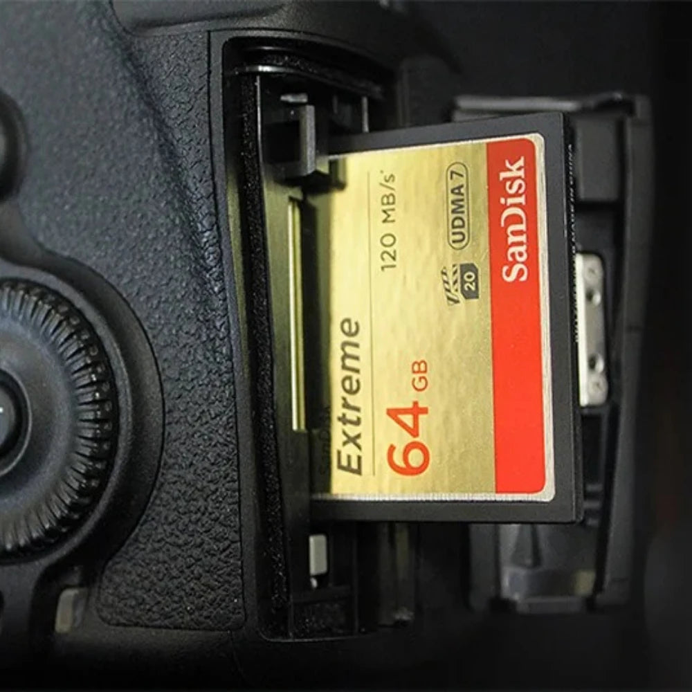 Gold and black SanDisk Extreme 32GB CompactFlash card marked 120 MB per second and UDMA 7