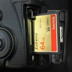 Gold and black SanDisk Extreme 32GB CompactFlash card marked 120 MB per second and UDMA 7