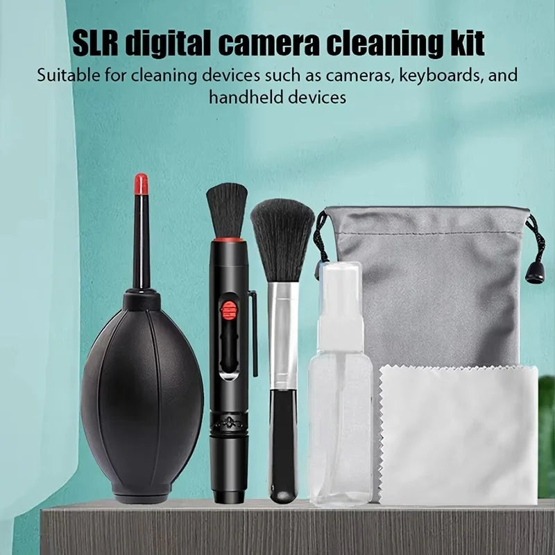 Camera cleaning kit on a shelf: black air blower, lens pen, soft brush, empty spray bottle, cloth and gray drawstring pouch