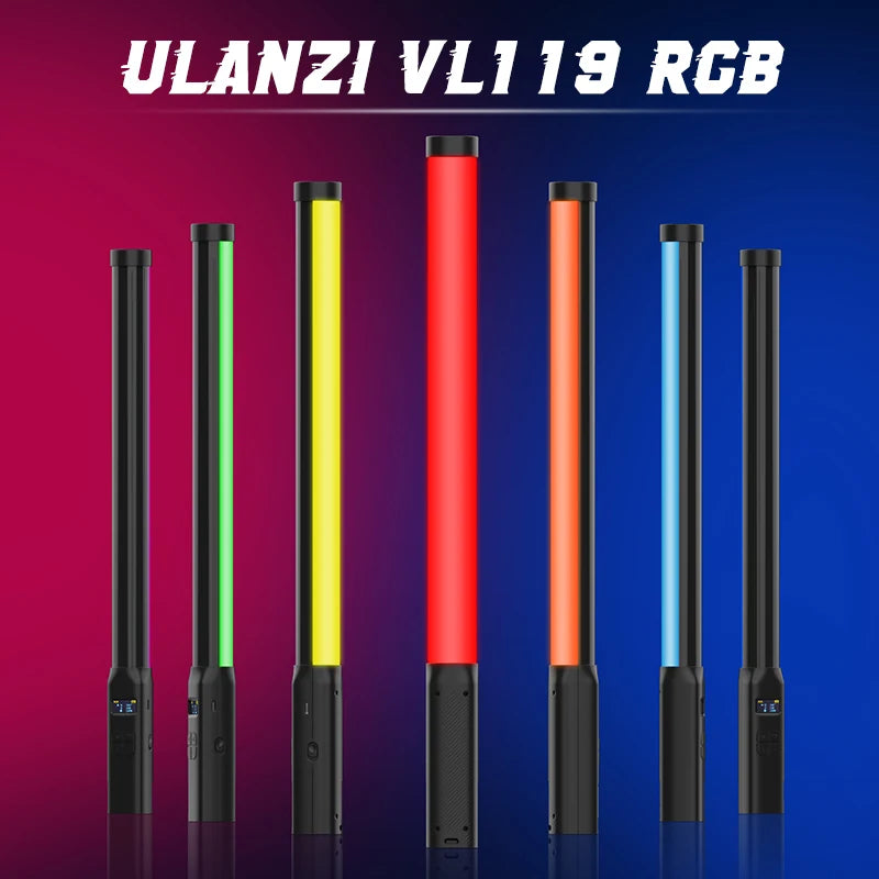 Seven black tube-shaped LED light wands glowing green, yellow, red, orange and blue on a pink and blue background