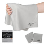 Hand holding a large gray microfiber cloth, with two gray cloths in sleeves and a gray retail package below