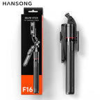 Black folded selfie stick with a red ring and a fold-out phone clamp, standing beside its black and orange F16 box
