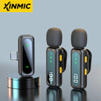Black USB-C wireless receiver beside two clip-on transmitters with foam windscreens, digital displays and yellow buttons