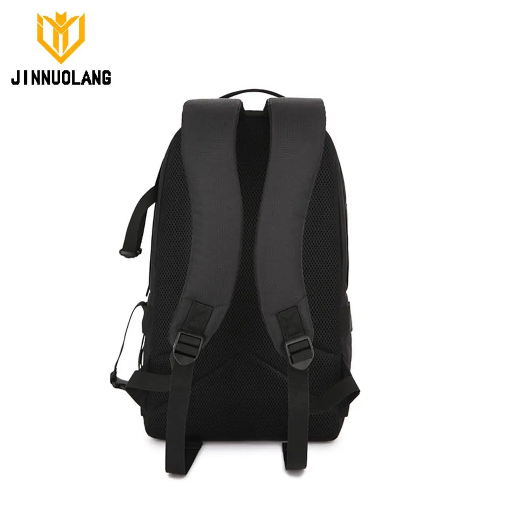 Black Jinnuolang camera backpack with a side access panel open to a grey padded camera compartment