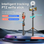 Black and orange selfie stick tripod holding a phone between two round fill lights, with a small remote and folded views