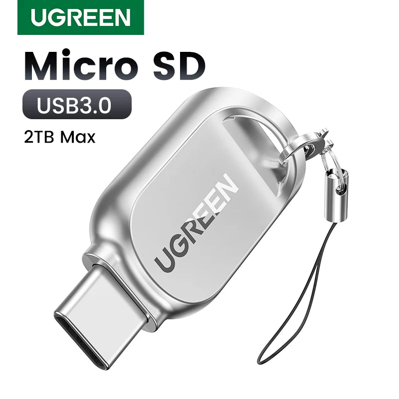 Small silver metal microSD card reader with a USB-C plug and a short wrist strap on a split ring