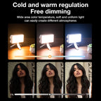 A white pocket-sized LED panel light glowing warm white, held in one hand against a dark background