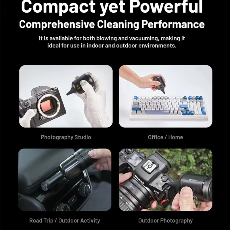 Hand holding a small black Nitecore BB Nano electric blower with a tapered rubber nozzle