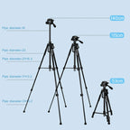 Black aluminum tripod with a handled pan head holding a mirrorless camera, shown folded beside a black drawstring carry bag