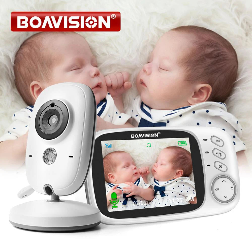 White baby monitor camera on a stand next to a Boavision parent unit whose screen shows two sleeping babies