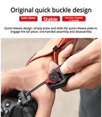 Orange camera wrist strap with a black clip worn on a wrist, the hand holding a black mirrorless camera
