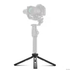 Black metal mini tripod with a 1/4 inch screw on top, shown with its legs in four positions from flat to upright