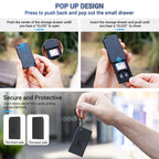 Black Kiorafoto pop-up card case open with an SD card and two microSD cards in its slots, shown with a carabiner