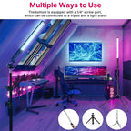 Seven black tube-shaped LED light wands glowing green, yellow, red, orange and blue on a pink and blue background