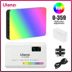 White pocket LED light with a small color screen, shown glowing in rainbow colors, with a diffuser cap, mount and cable