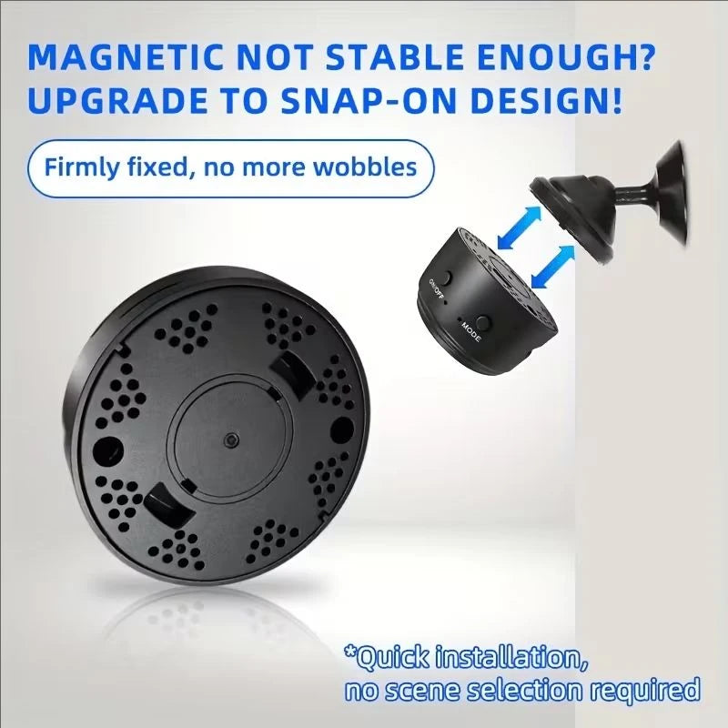 Four round black mini cameras with a magnetic stand and USB cable, next to a phone showing a street view in the app