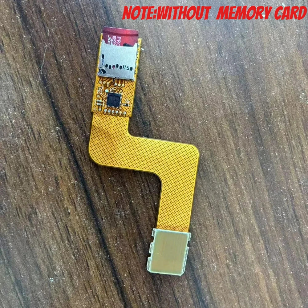 PSP Go console lying face up with an orange ribbon adapter attached at the left edge and a Memory Stick entry on screen