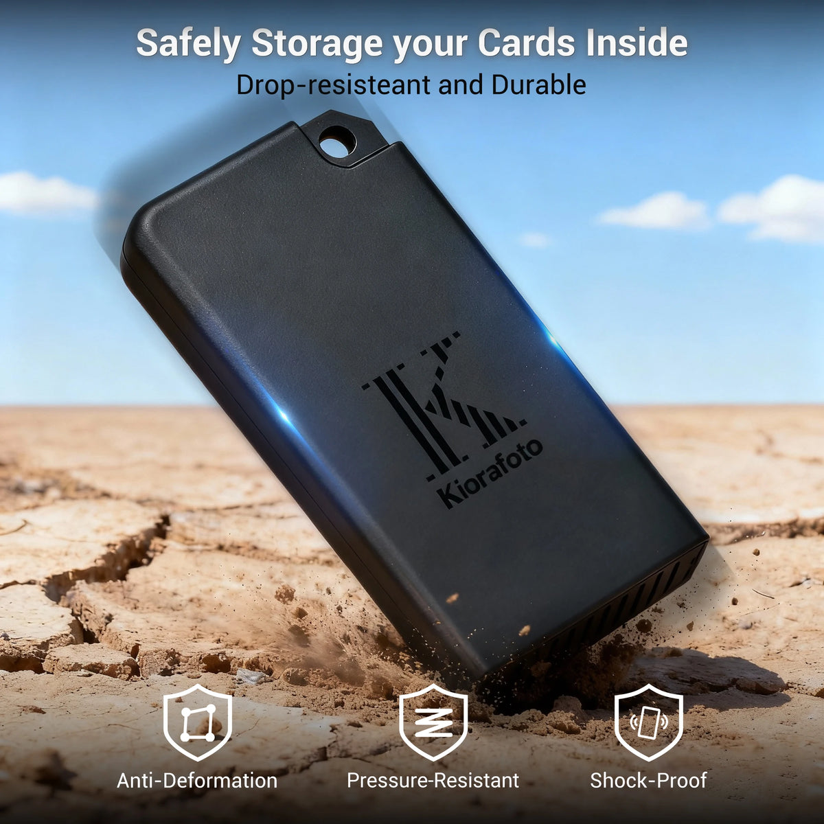 Black Kiorafoto pop-up card case open with an SD card and two microSD cards in its slots, shown with a carabiner