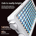 Two pocket-sized LED panel lights with control dials, one champagne and one grey, glowing warm white on a dark surface