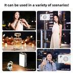 Two pocket-sized LED panel lights with control dials, one champagne and one grey, glowing warm white on a dark surface