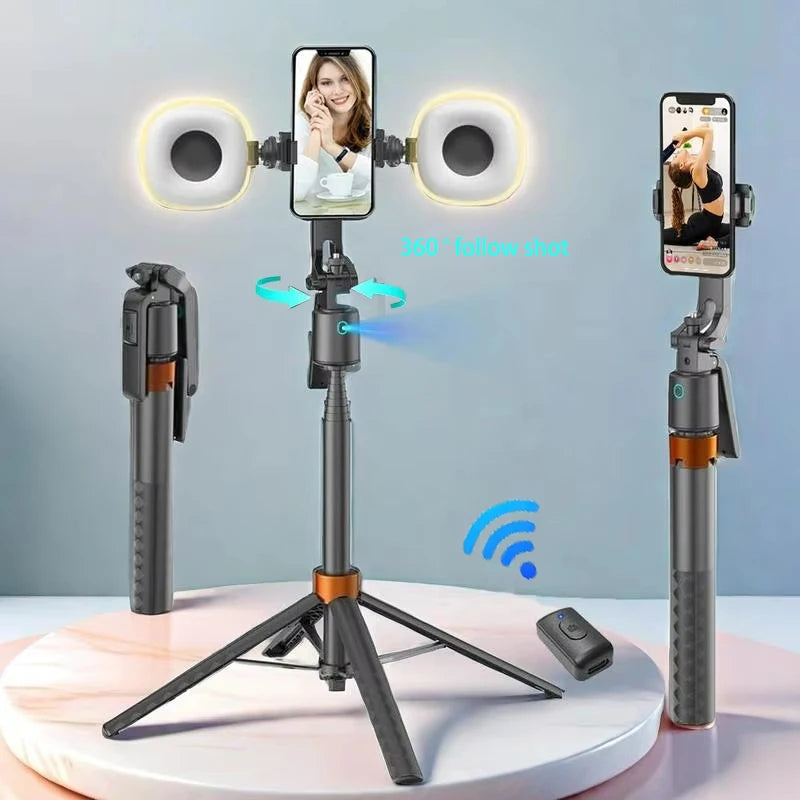 Black and orange selfie stick tripod holding a phone between two round fill lights, with a small remote and folded views
