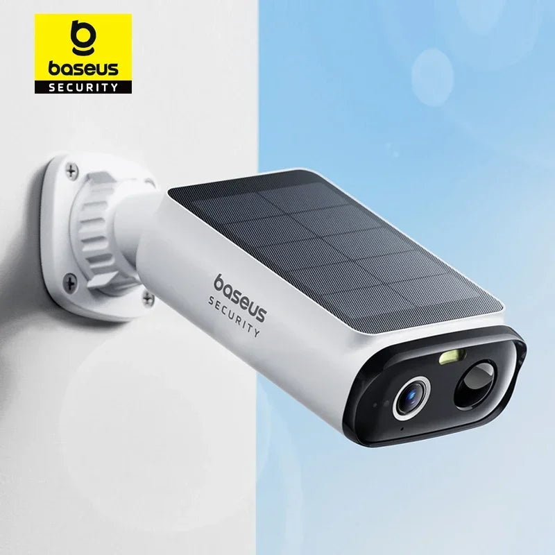 White Baseus Security bullet camera with a solar panel on top, mounted on a white wall against a blue sky