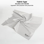 Hand holding a large gray microfiber cloth, with two gray cloths in sleeves and a gray retail package below