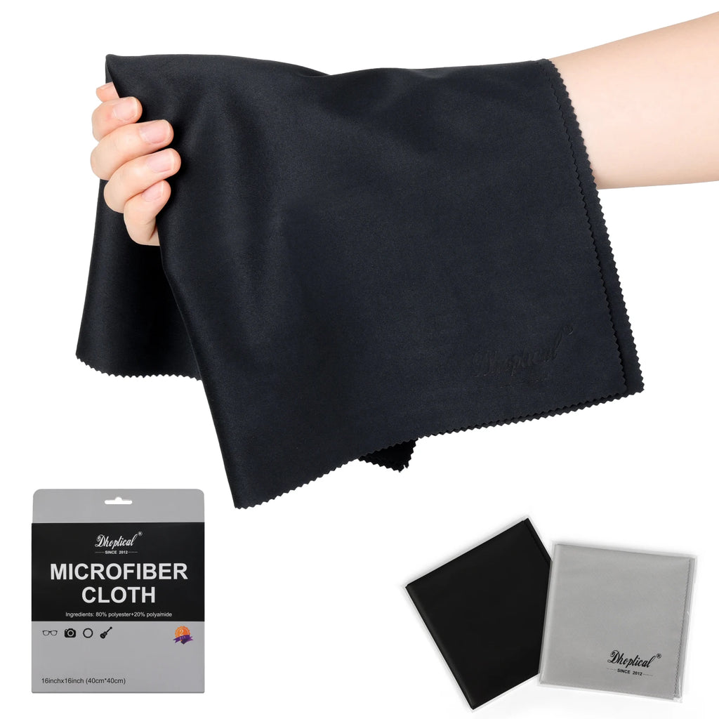 Hand holding a large black microfiber cloth, with a black and a gray cloth in sleeves and a gray retail package below