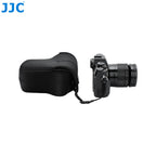Contoured black soft camera pouch with a zip around the body and two small loops, shown closed on a white background