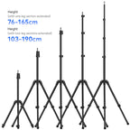 Black Ulanzi light stand with three legs and a stud on top, shown folded compact and being packed into a travel bag