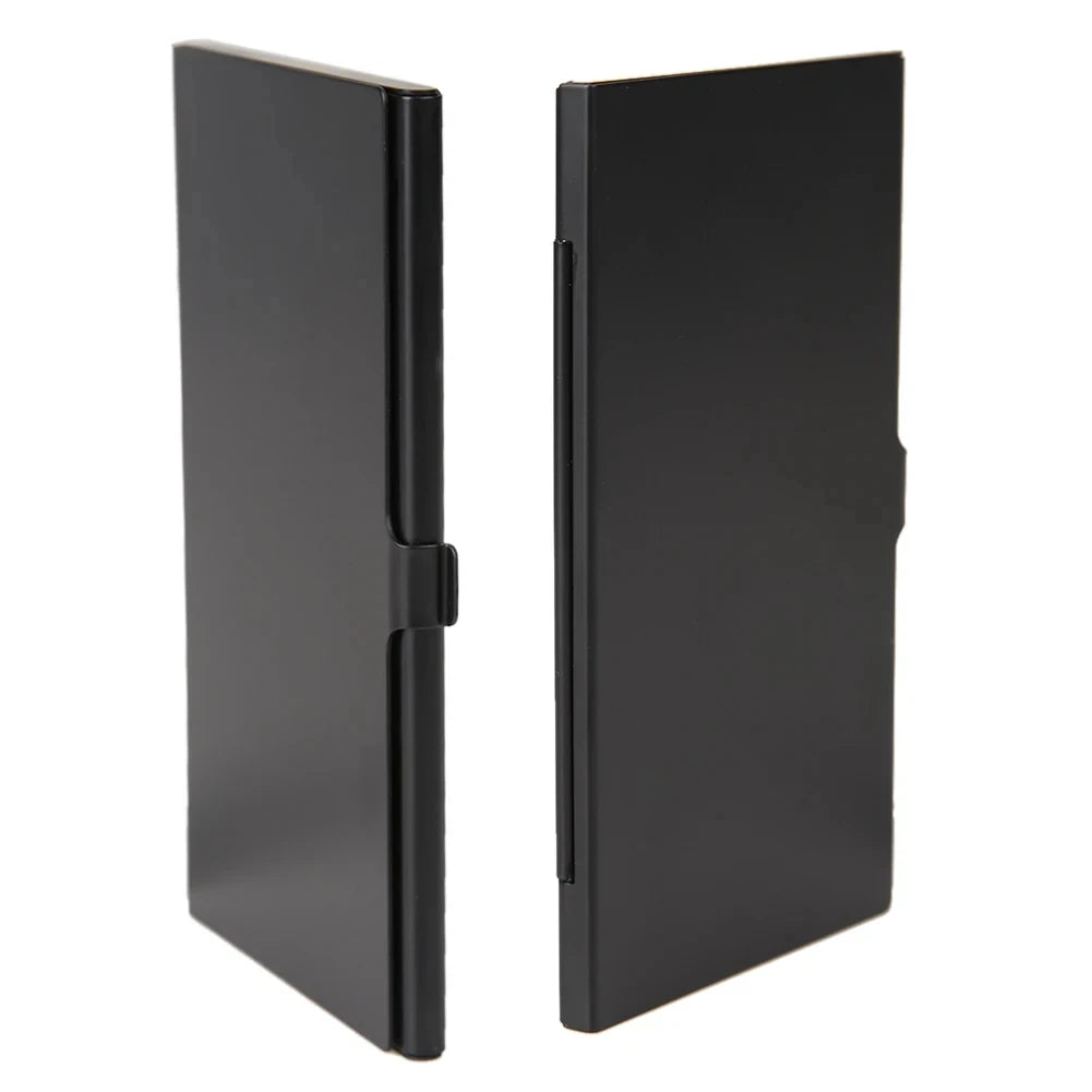 Open black metal card case holding twelve microSD cards in foam-lined slots