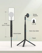 Golfer mid-swing beside a black stand holding a phone on a magnetic mount, with a ground spike, mini tripod legs and parts