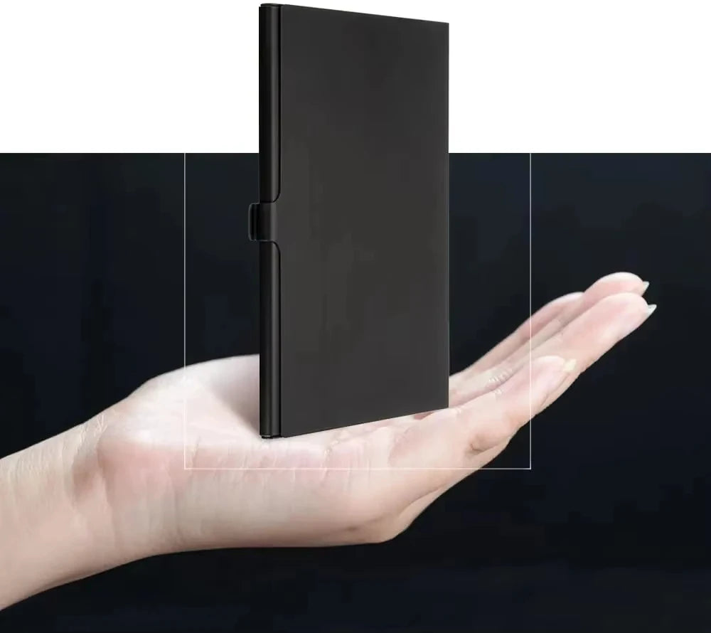 Open black metal card case holding twelve microSD cards in foam-lined slots