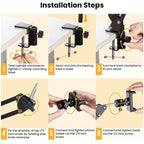 Black spring-loaded arm clamped to a table, holding a phone on a ball head, shown with a remote, a phone clip and a clamp