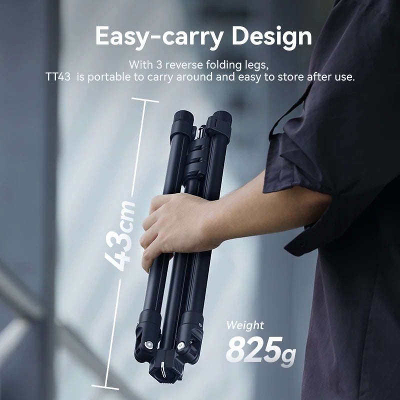 Black Ulanzi light stand with three legs and a stud on top, shown folded compact and being packed into a travel bag