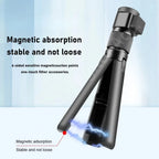 Black mini tripod handle with a rotating top and 1/4 inch screw, swinging a stick and holding a 360 camera on a table
