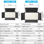 Two LED panel lights with barn doors on tall tripod stands, one lit warm, with power adapters, a remote and a battery