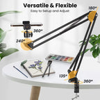 Black spring-loaded arm clamped to a table, holding a phone on a ball head, shown with a remote, a phone clip and a clamp