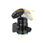 Black mini ball head with an orange rubber top plate, a locking knob and a degree scale, beside a double-nut shoe adapter