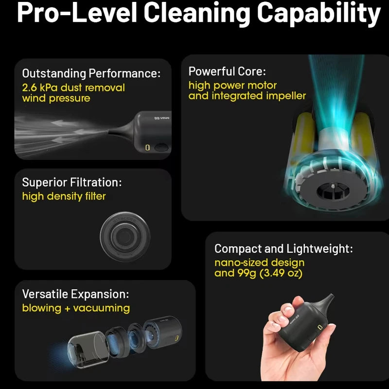 Hand holding a small black Nitecore BB Nano electric blower with a tapered rubber nozzle