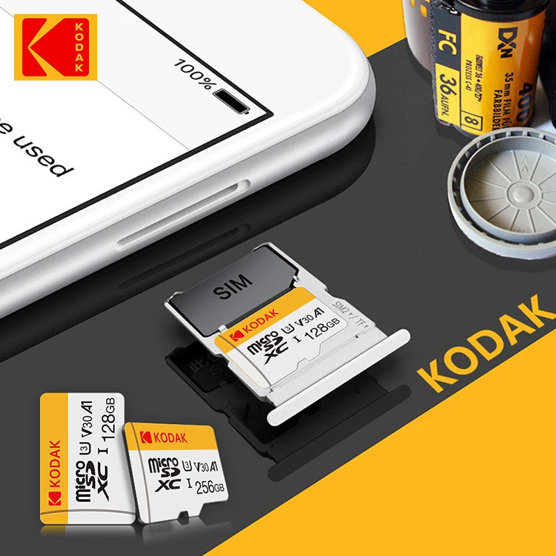 White and yellow Kodak-branded microSD cards in 128GB, 32GB and 64GB, beside a yellow microSD to SD adapter